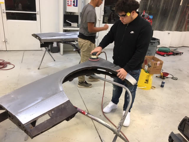 axelrod collision team working on fender