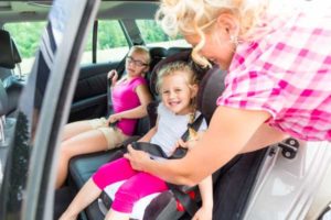 Fairview Park Auto Body Repair - Woman putting child in car seat